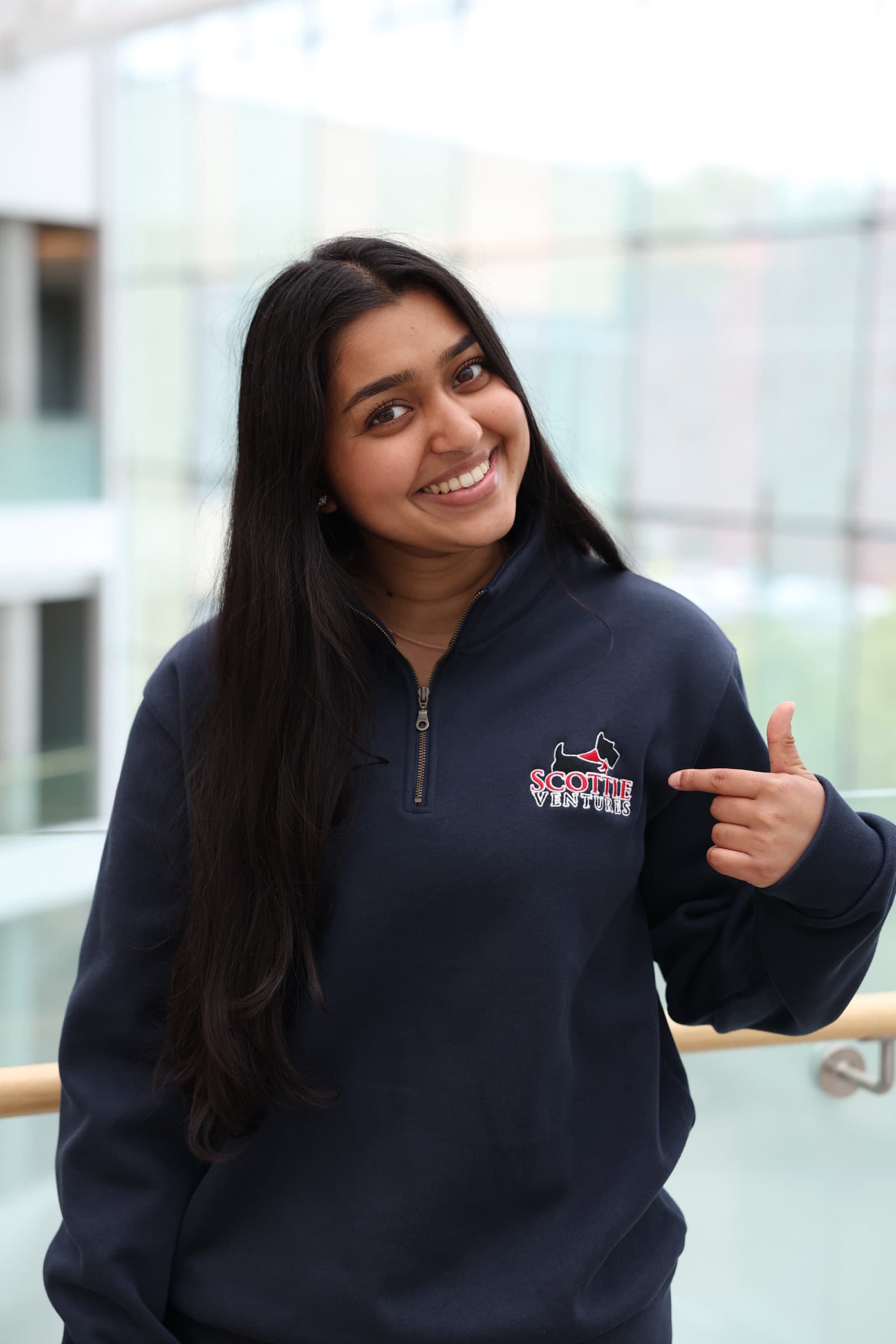 A Scottie Ventures member wearing club merch